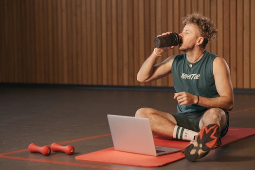 Man Drinking from a Tumbler